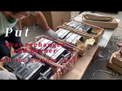 Mettere scambiatore di calore e bruciatore sul guscio inferiore